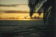  [Sunset with sailboat on horizon from our HalePōhaku lānai] 